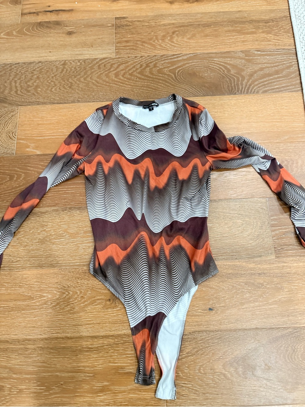 Fashion Nova Long-Sleeve Wave Print Bodysuit in Orange, Brown, and Cream